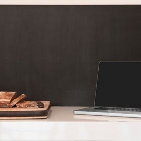 laptop wineglass and bread loaf on counter picture id481634329